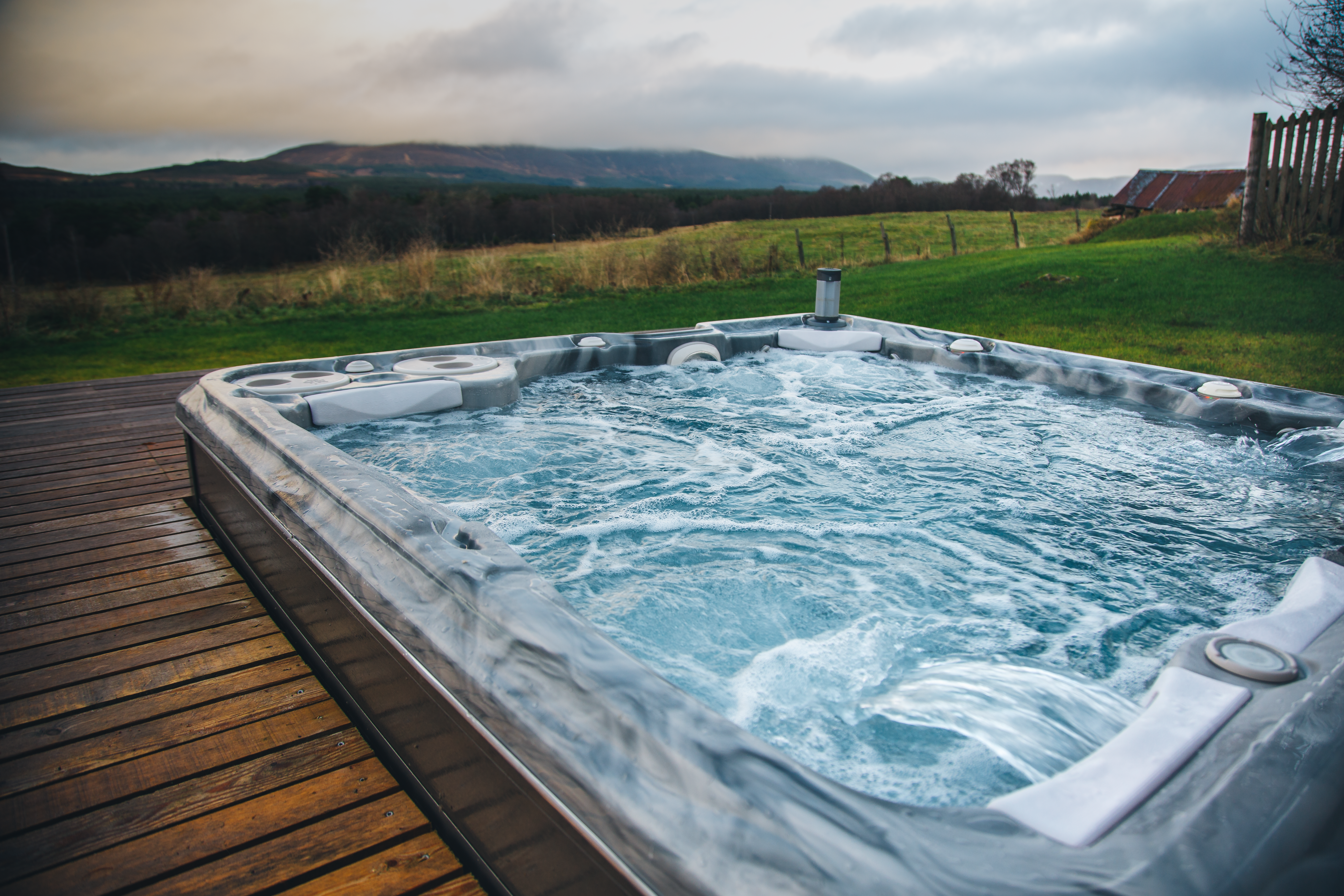 Hot tub in decking with stunning view 